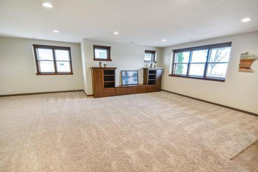 Expansive 32X 28 room with adjacent wet bar for entertaining. Look out the windows to enjoy the views.