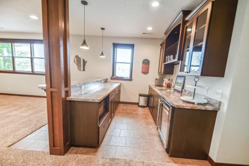 Wetbar with microwave and dual counters.