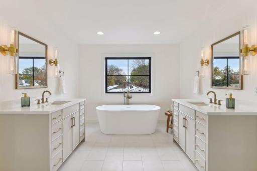 Porcelain Flooring, Custom Vanities, and Elegant Soaking Tub