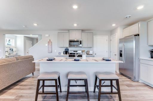 The incredible kitchen will be the heart of your new Princeton with living, dining and gathering spaces all just within reach. (Model photo, colors may vary.)