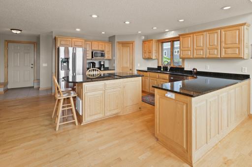 Gorgeous Kitchen with beautiful Granite counter tops,custom Hickory cabinets, raised panel doors and in floor heat!