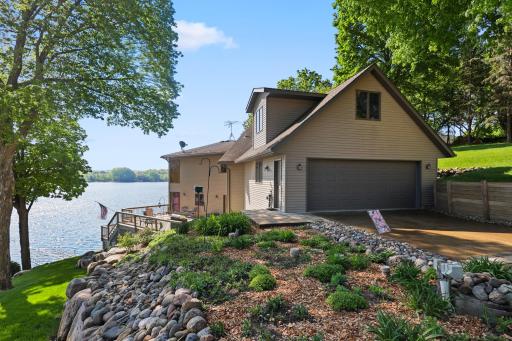 Lots of great landscaping. Vinyl covered steel siding for easy maintenance. The garage can park three cars with one in tandem. It is 829 sq. ft.
