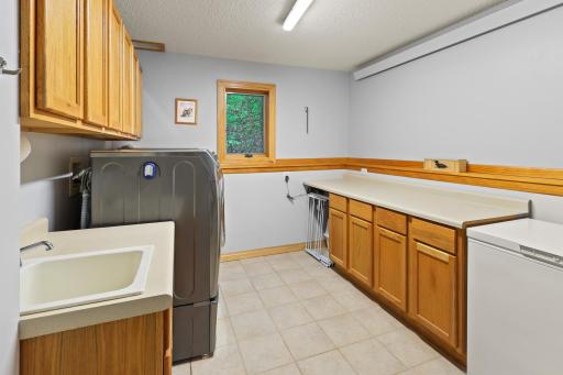 Huge main level laundry too with built-in cabinets & counter.