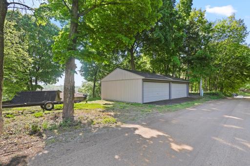 The property includes a 4 car 28 x 39' garage with concrete floor & 220 amp electric. Great place to store the lake toys.