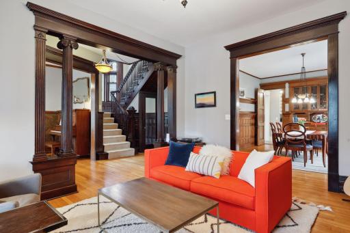 The gracious foyer offers gleaming hardwood floors that extend throughout the main level, and rich natural woodwork.