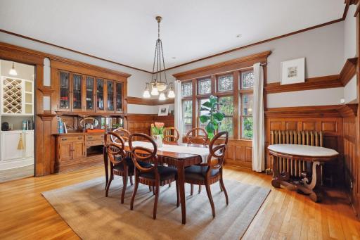 Note the beautiful built-in buffet and rich carved paneled walls.