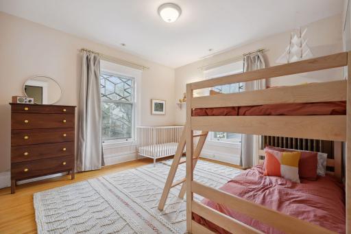 The 4th bedroom. All bedrooms on this level have hardwood floors and bright windows with treetop views.