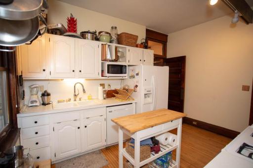 1st floor kitchen with microwave, dishwasher, refrigerator and stove.