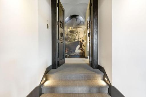 The extraordinary primary wing features a spacious bedroom with stunning views & an adjoining sitting room, an incredible indoor/outdoor hot tub room, an enormous walk-in closet & dressing room, private gym, and luxurious spa-like bathroom.