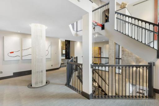 The second level features a large loft art gallery space with lighted display alcoves.