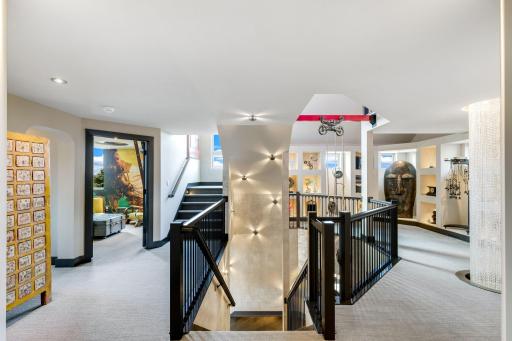 The second level features a large loft art gallery space with lighted display alcoves.