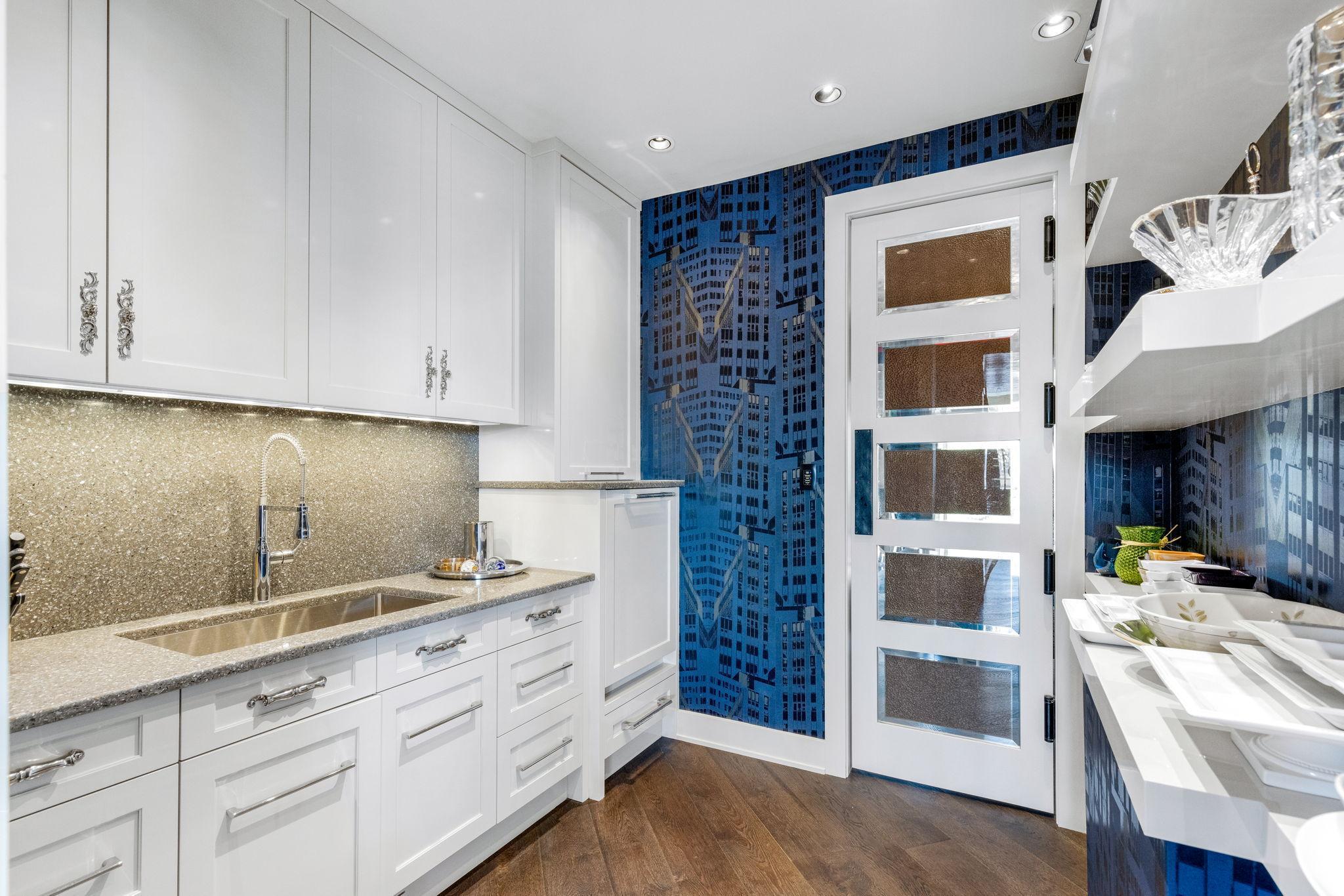 A spacious butler’s pantry with abundant storage, shelving, an additional dishwasher and large sink
walks through to the formal dining from the kitchen.