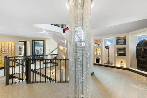 The second level features a large loft art gallery space with lighted display alcoves.