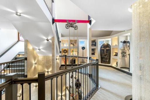 The second level features a large loft art gallery space with lighted display alcoves.