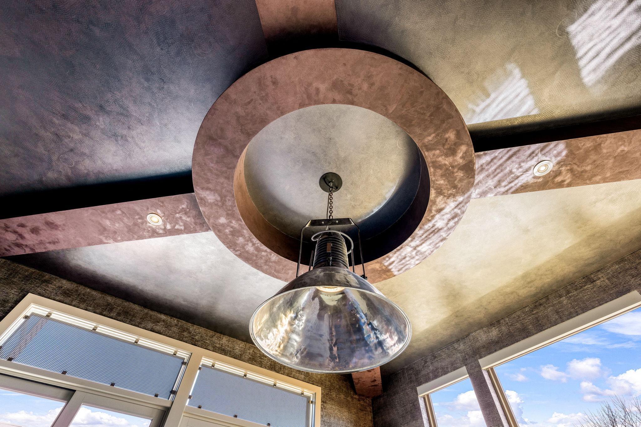 The sun filled game room walks out to a private deck overlooking the vast estate.