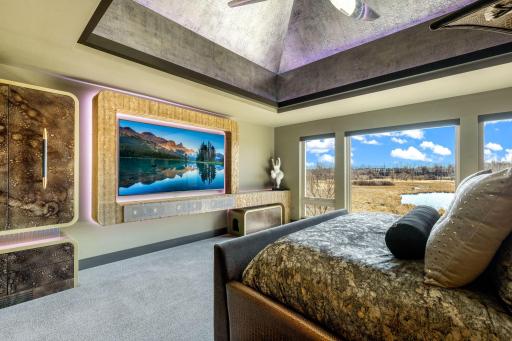 The extraordinary primary wing features a spacious bedroom with stunning views & an adjoining sitting room, an incredible indoor/outdoor hot tub room, an enormous walk-in closet & dressing room, private gym, and luxurious spa-like bathroom.