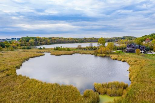 The home overlooks it's private pond along with Pomerleau Lake.