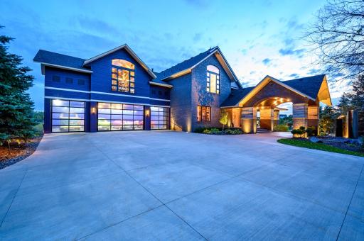 The completely finished upper level 4-car garage features insulated glass garage doors, extensive lighting and a
disco ball. The ceiling height is set to allow for lifts which doubles the capacity from 4 to 8, bringing total garage capacity to 13.