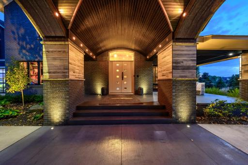 A beautiful porch wraps from the front to the side of the home where you can grill and entertain with convenient access to the chef's kitchen.