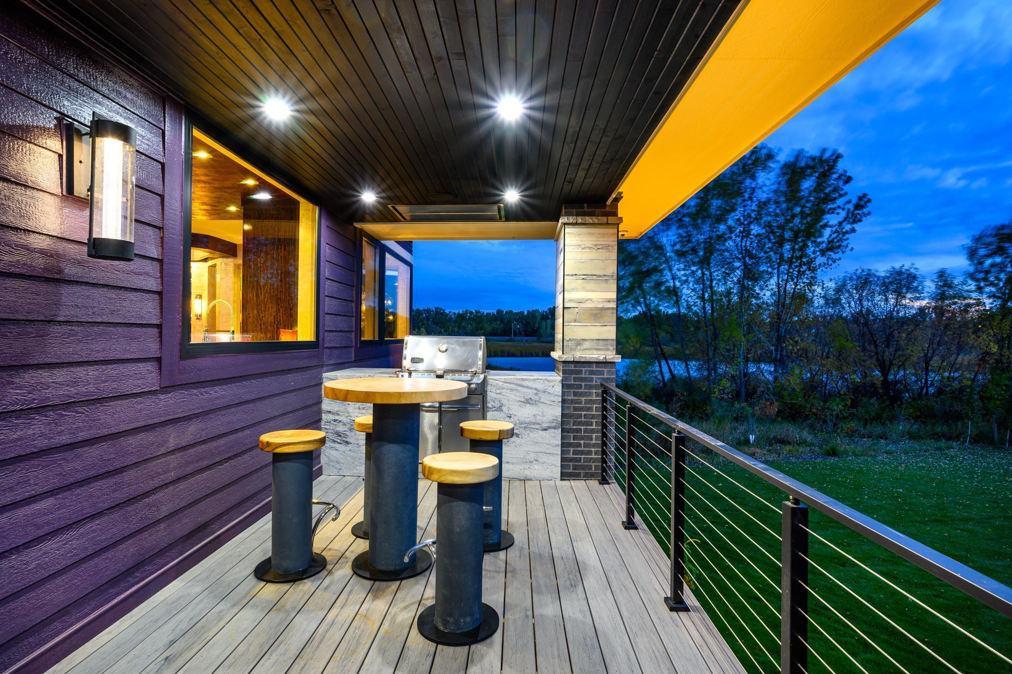 A beautiful porch wraps from the front to the side of the home where you can grill and entertain with convenient access to the chef's kitchen.