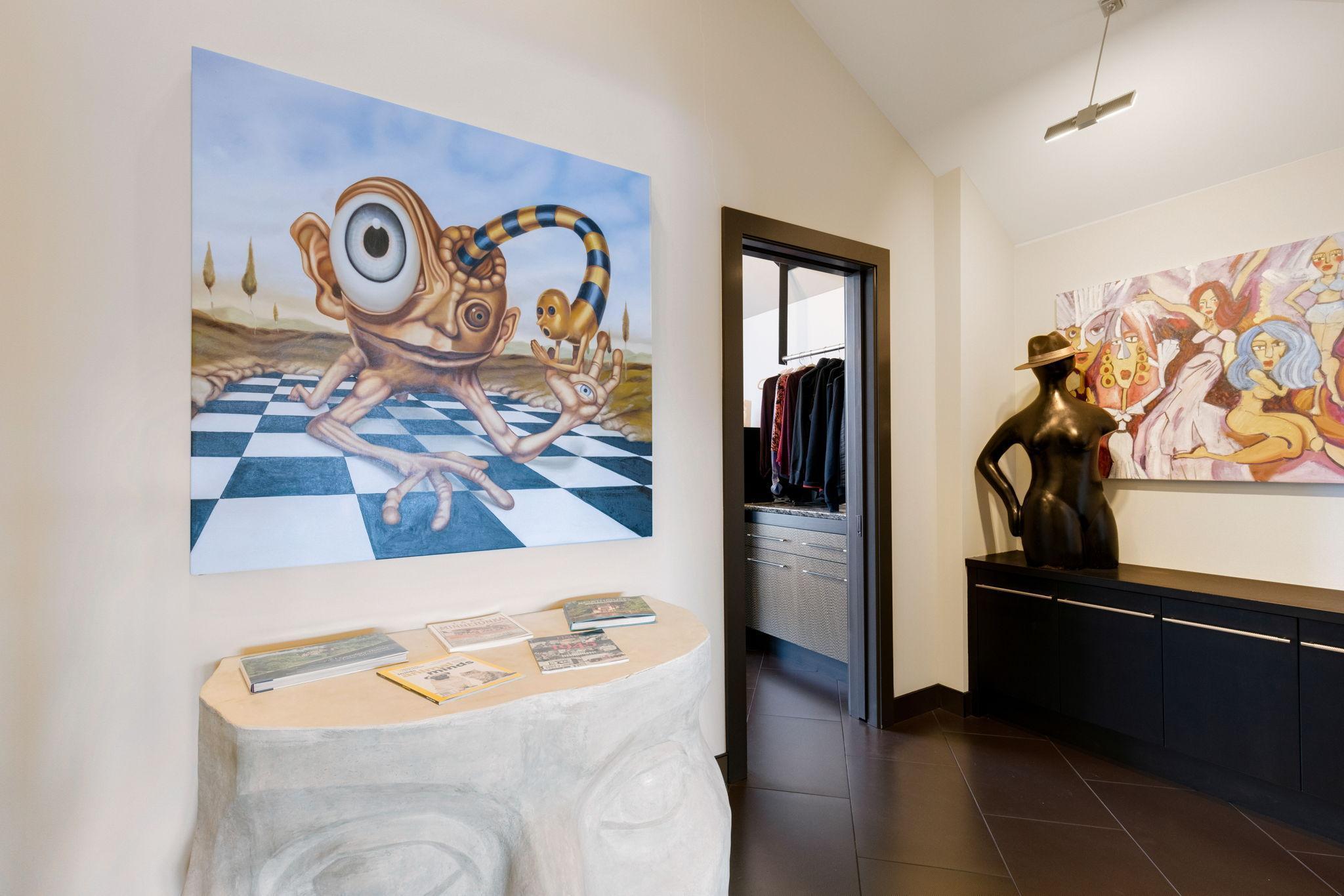 An enormous walk-in closet with floor to ceiling windows and unique features throughout leads
to a spacious dressing room and large laundry room with flex space for crafts or storage.