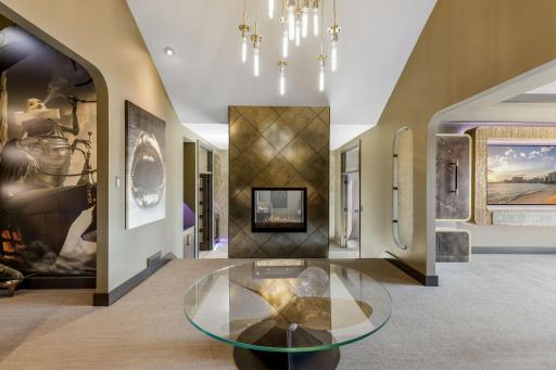 The extraordinary primary wing features a spacious bedroom with stunning views & an adjoining sitting room, an incredible indoor/outdoor hot tub room, an enormous walk-in closet & dressing room, private gym, and luxurious spa-like bathroom.