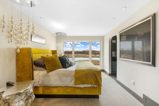 Another second floor bedroom offers stunning views of the estate.