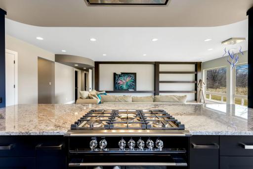 A bright and open chef’s kitchen is open to the dining and living space.