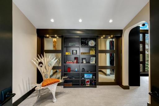 An enormous walk-in closet with floor to ceiling windows and unique features throughout leads
to a spacious dressing room and large laundry room with flex space for crafts or storage.