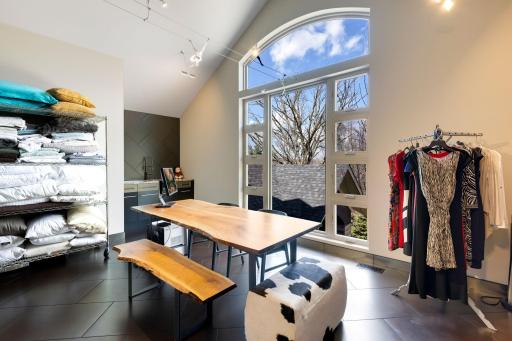 An enormous walk-in closet with floor to ceiling windows and unique features throughout leads
to a spacious dressing room and large laundry room with flex space for crafts or storage.