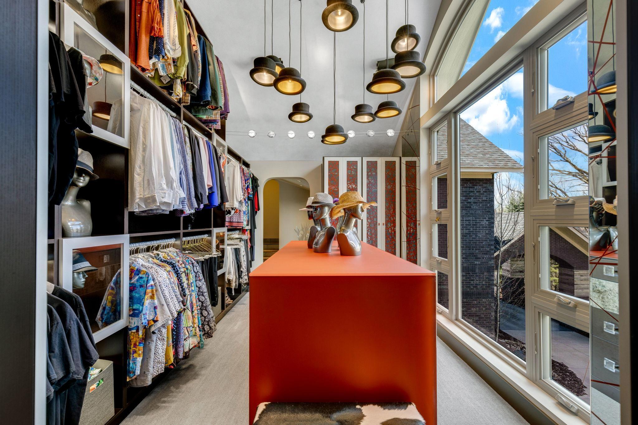 An enormous walk-in closet with floor to ceiling windows and unique features throughout leads
to a spacious dressing room and large laundry room with flex space for crafts or storage.