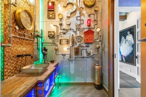 The remarkable main floor half bath is filled with steampunk dÃ©cor and mood lighting.