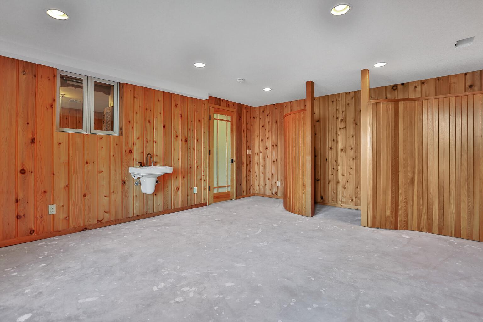 Back side of the Beach Room has a walk in shower after you coming in from swimming or enjoying the lake.