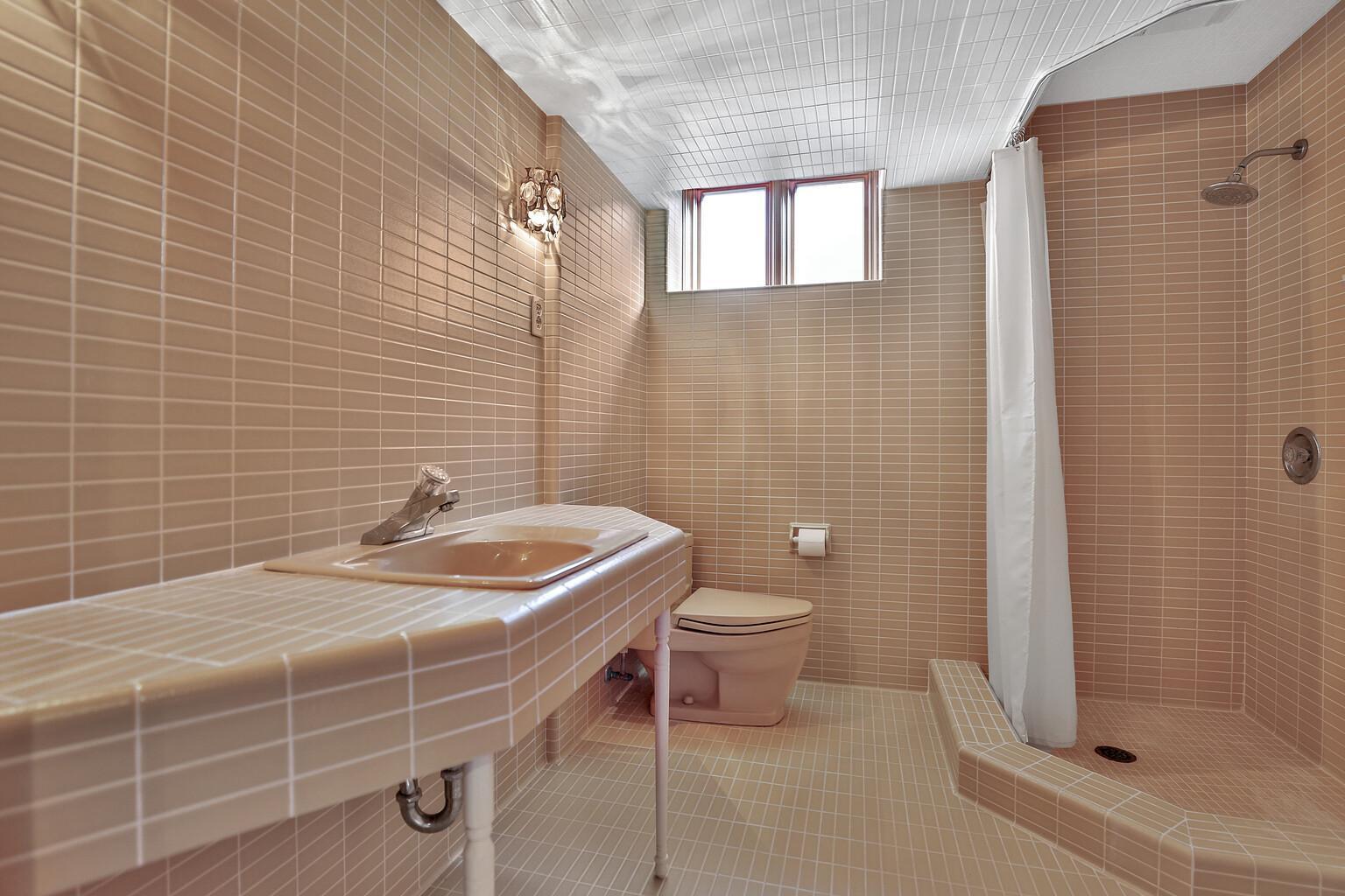 Basement 3/4 bath with original tile work.