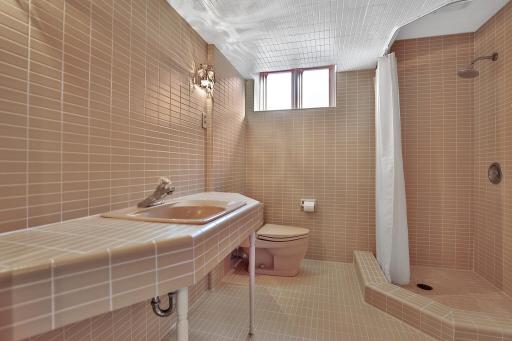 Basement 3/4 bath with original tile work.