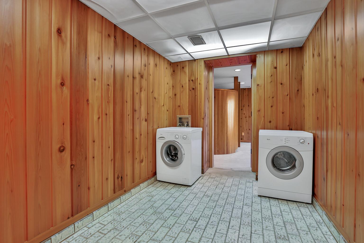 Laundry area in lower level and access to home expansion project.