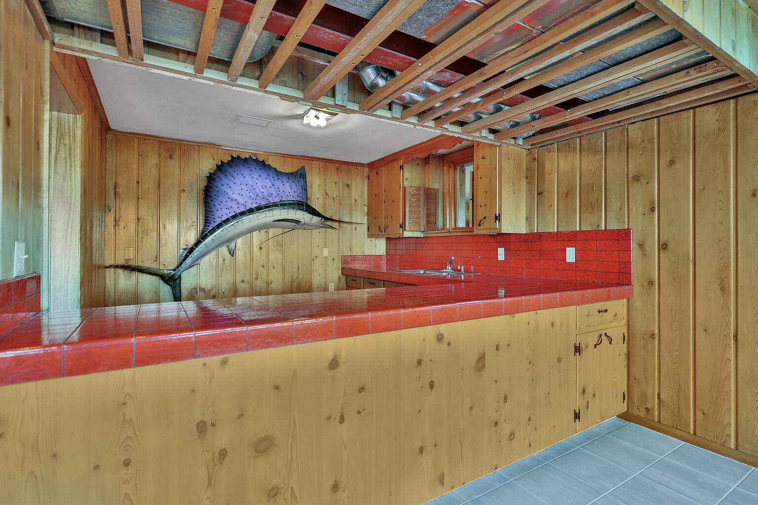 Sink and back splash in bar area. Room for a refrigerator as well.