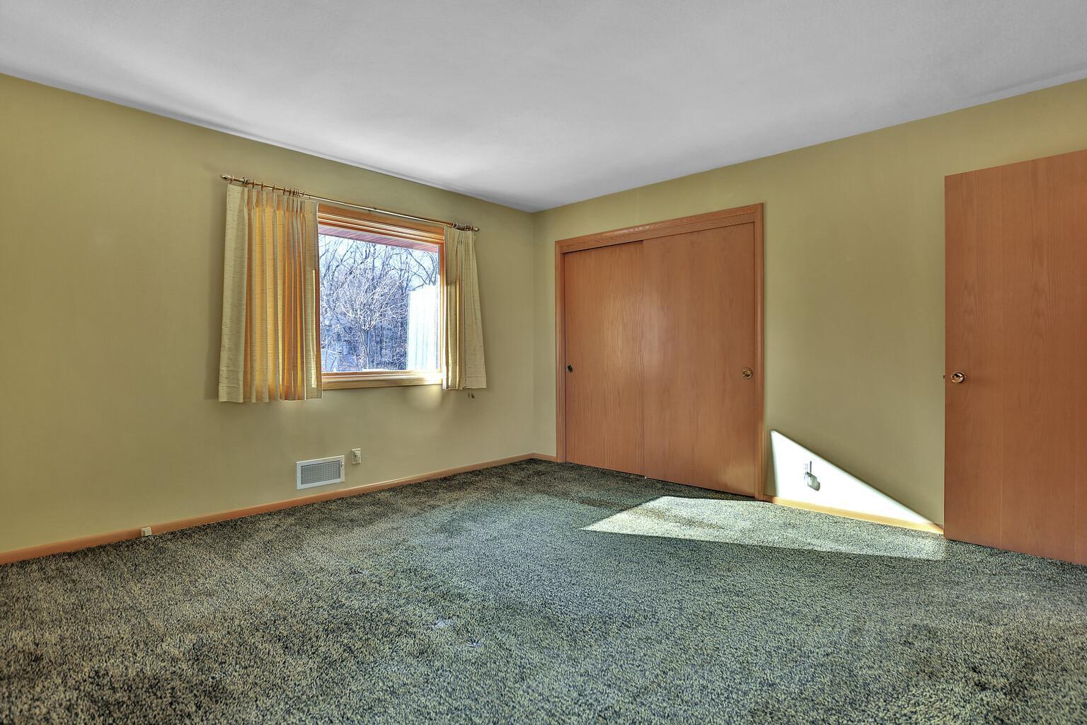 One of the two main floor bedrooms.