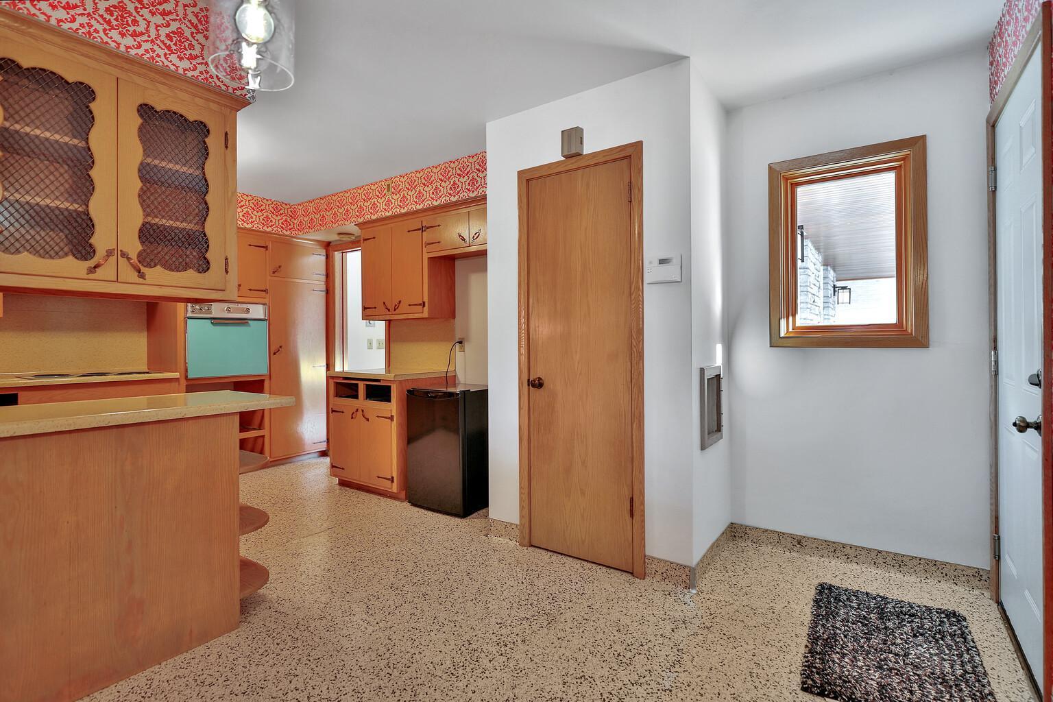 Entry from garage to the right, pantry in center.