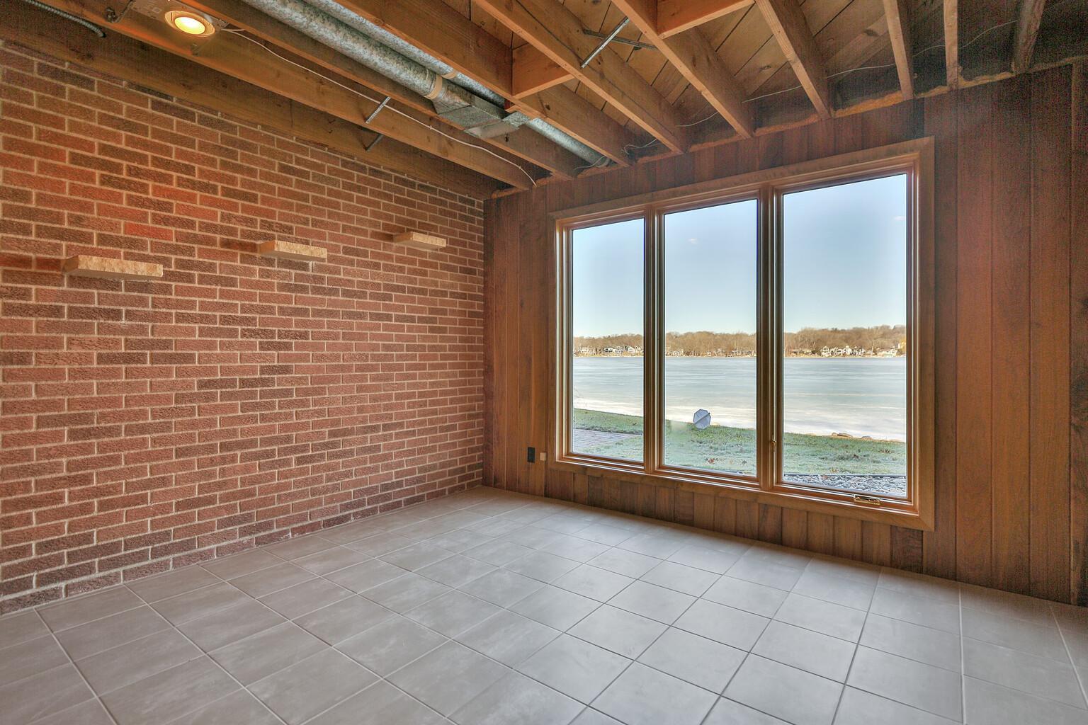 Lower level bedroom at lake side (below the main floor den.