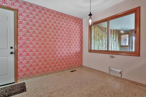 Windows provide the view to the finished shell that is spray foam insulated. Plans for removing the wall and doubling the size of the kitchen ceased shortly after the exterior was completed.