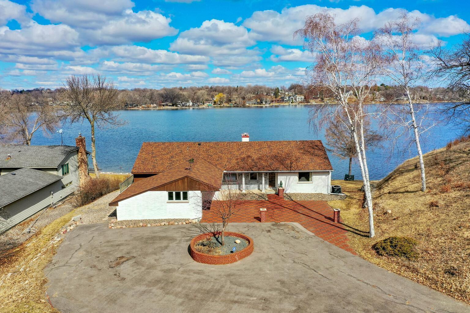 Circle drive and paver parking area.