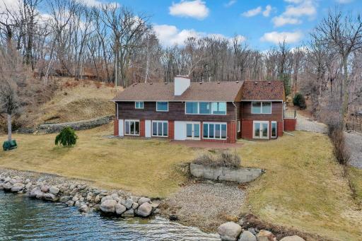 Gradual slope to the water front. Partially finished addition on the right side of the home.