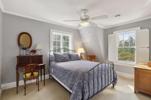 The bedrooms all have character with the large windows, crown moldings and appealing decor.