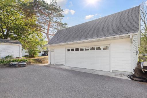 In addition to the two car attached garage, there is a heated back garage / workshop with a bathroom and large finished loft area, and space for several cars inside. There are several parking spot and a place for a large RV or trailer to be parked.