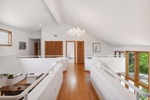 Open Hallway to Laundry Room and Bedroom Suites