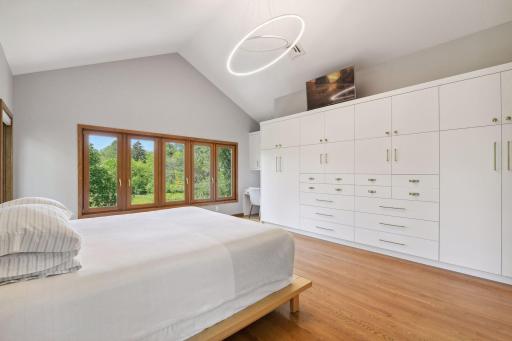 A Wall of Custom Built-In Cabinetry and a Separate Walk-In Closet