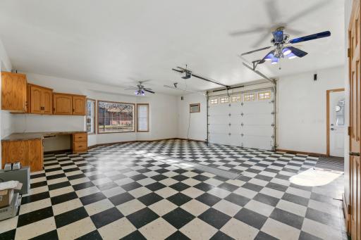 This is the attached single car garage, with in-floor heat and 1/2 bath. This space was used as a gathering space/ entertainment area, but certainly can still be used as a garage.