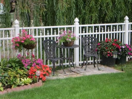 Beautiful gardens with fenced in the backyard