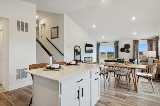 Enjoy plenty of seating at the kitchen island and dining area adjacent to the kitchen. Perfect for entertaining or having a family meal together.